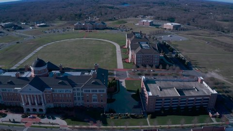 Aerial dolly shot of the Kannapolis NC city complex. Looking over the complex grounds at all the buildings.