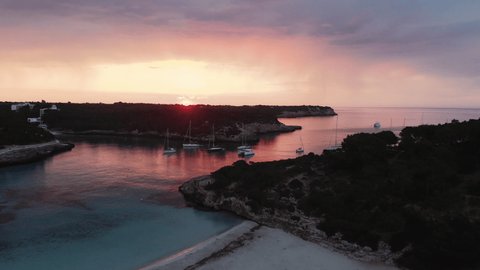 Sailboats in a bay at early morning sunrise aerial on Mallorca Island Video Stok
