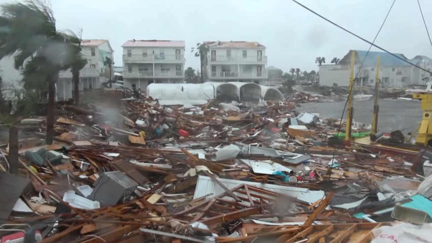 A strong hurricane destroyed houses. Lots of rubbish and floating leftovers at home | Shutterstock HD Video #1045742905