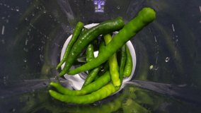 Hot Green Chili Peppers Poured By Fresh Water To Wash And Clean In Blender As A Healthy Nutrition Food And Drink For Vegetarian Also For Spicy Food Or Dish, RAW Full HD And 4K Video. 