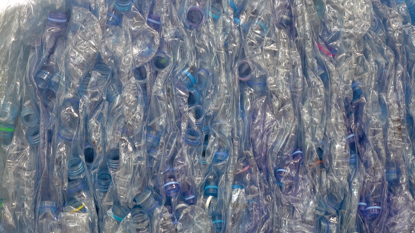 Many empty plastic bottles are compressed. Waiting to enter the recycling process Royalty-Free Stock Footage #1045757068