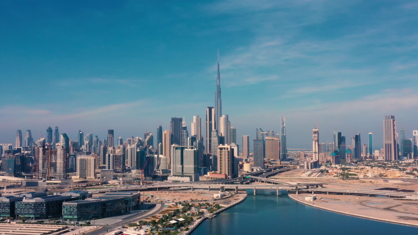 AERIAL. Drone video of Dubai city at day time. Modern city concept vith transport and river.