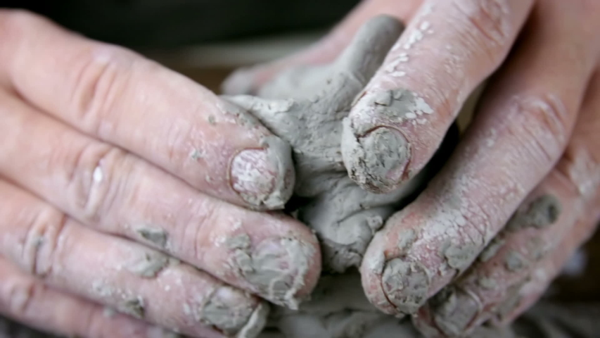 Sculptor man creating sculpture from clay in workshop. Process of making a clay figure.  Royalty-Free Stock Footage #1045775692