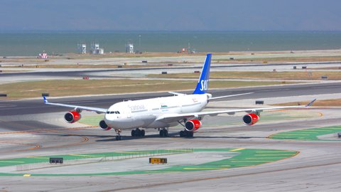 SAN FRANCISCO, CA - 2020: SAS Scandinavian Airlines Airbus A340 Jet Airliner Jet Airliner Arriving after Landing on Runway and Taxiing to Terminals at San Francisco SFO International Airport at Day
