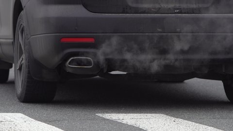 car exhaust from the exhaust pipe. toxic smoke pollutes the atmosphere. smog. air pollution problem. global warming concept