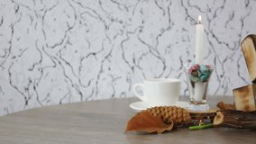 cup of coffee with candle and tulip on spinning wooden table background. FHD.