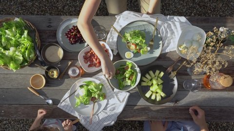 Family dinner with organic salad on rustic wooden table, Food healthy organic vegetable concept with top view