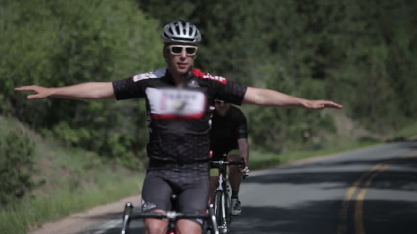 Riding no hands on bicycle