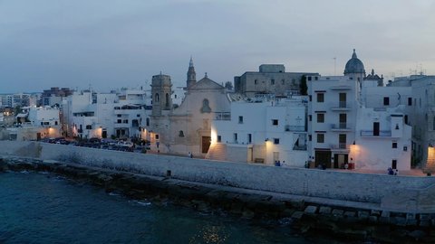 Aerial view of1 the old town of Monopoli, at dusk, Puglia, Italy,