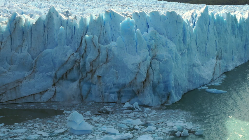 Perito Moreno glacier in Los Glaciares National Park near El Calafate, Argentina,  view of massive ice chunks collapsing into the water.  Royalty-Free Stock Footage #1045843249