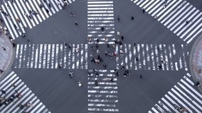 4K High Angle view of busy crowd people pedestrian crossing intersection street crosswalk in Japan. Business people and tourist walking on footpath at downtown district working or shopping in the city - Powered by Shutterstock - Get 15% off with code: PIKWIZARD15
