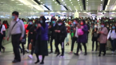 blurred masked people with motion in Hong Kong 