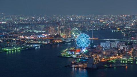 Time Lapse of Osaka ;  Aerial View of Osaka at night City Skyline Ferris Wheel Landmark ,City of life concept
