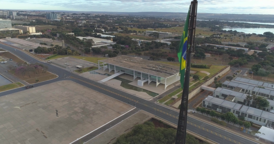 Aerial of the iconic Brazilian Presidential office building Planalto Palace and national flag in Brasilia, Brazil