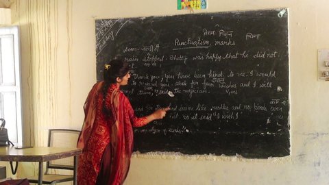 Fatehabad, Haryana, India - 1 October, 2019: Unidentified Female Indian teacher teaching in classroom. 