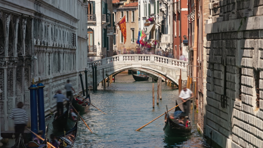 Time lapse shot of Gondolas floating on canal under of the Bridge of Sighs (Ponte dei Sospiri), Venice, Italy
