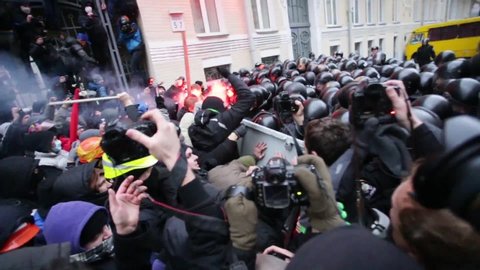 KYIV, UKRAINE - DEC 1, 2013: Protesters in conflict with riot police on Bankova street during protests, demonstrations and civil unrest aka "Euromaidan"