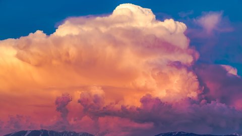 Flying through the beautiful cloudscape. flying in the clouds. Aerial perspective view of flying over clouds.Blue sky with clouds and sun. Brightly red cumulus clouds swirl at sunset. 4K Time lapse Stock Video