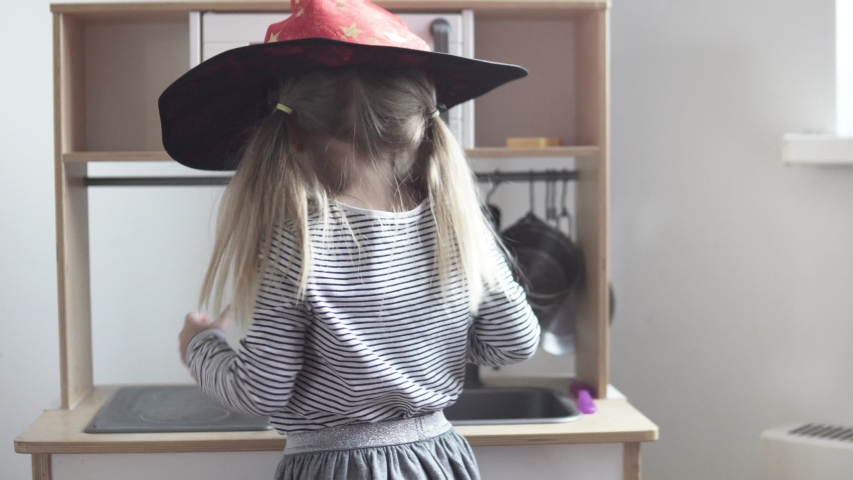 A cute little girl plays in the children