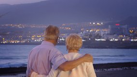 Senior couple in love by the ocean at dusk in 4k slow motion 60fps - Powered by Shutterstock - Get 15% off with code: PIKWIZARD15