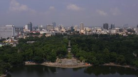 Aerial video of downtown Hanoi, Vietnam on Bay May Lake district on a beautiful sunny day.