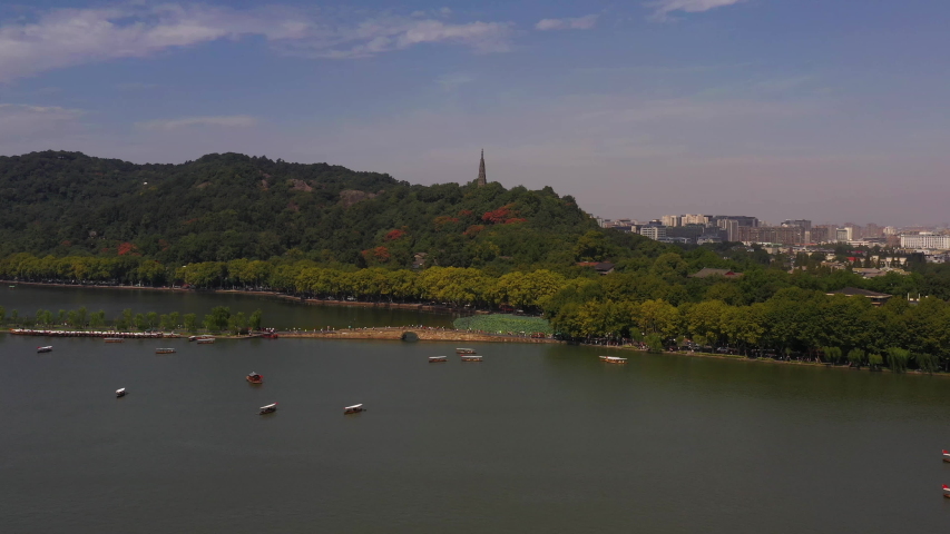 Aerial video of West Lake in Hangzhou China on a beautiful sunny clear day.