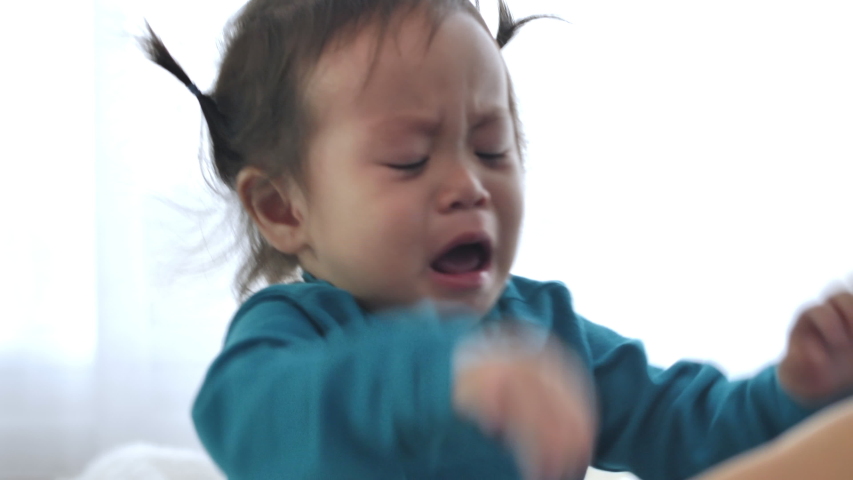 
Asian girl Crying and fussing. When a small child is sleepy, crying is a sign that it must be taken to bed. Royalty-Free Stock Footage #1045937092