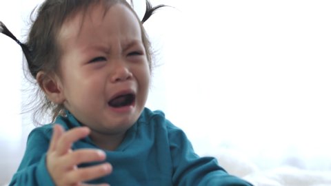 
Asian girl Crying and fussing. When a small child is sleepy, crying is a sign that it must be taken to bed.