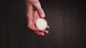 Slowmotion shot tossing a coin to flip on heads or tails quarter USD and reveals a tail eagle - Powered by Shutterstock - Get 15% off with code: PIKWIZARD15