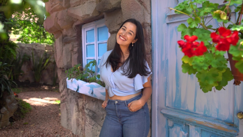 portrait of attractive woman smiling lookin at camera 
