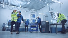 Industry 4.0 Factory: Team of Engineers, Technicians, Professionals and Workers, Working on Assembly and Production Line, Optimizing CNC Machinery, Programming Machines, Talking and Planning Projects - Powered by Shutterstock - Get 15% off with code: PIKWIZARD15