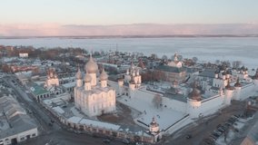 Top view of the Rostov Kremlin in winter. A historical place from above, in the frame Orthodox churches, crosses and domes. Aerial video