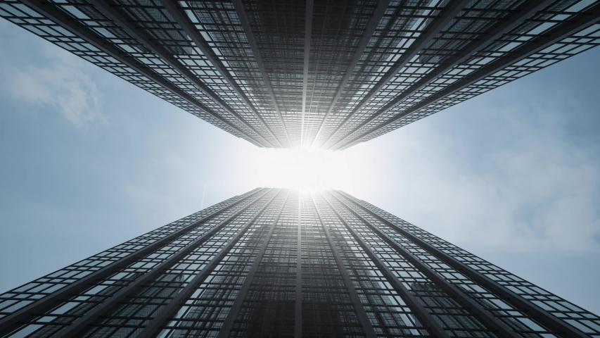 Airplane flies between high rise buildings crossing sun flare and reflects on glass facades. Sun flare and blue sky at background. Skyscrapers city center. Aircraft over corporate buildings.  Royalty-Free Stock Footage #1045968658