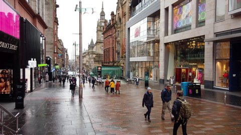 GLASGOW, UK - FEBRUARY 5, 2020: Pedestrians and high street shops on Buchanan Street on Glasgow, UK.