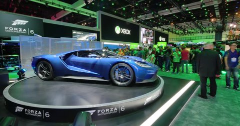 LOS ANGELES - June 16, 2015: Forza Motorsport 6 game booth at E3 2015 expo. Ford and Microsoft have entered into exclusive agreement that will make Ford GT the cover car for the game. Timelapse view.