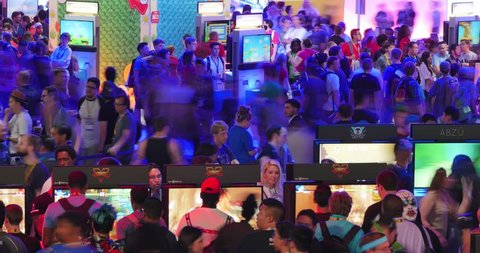 LOS ANGELES - June 16, 2015: Crowds of people at E3 2015 expo in Convention Center. Electronic Entertainment Expo, commonly known as E3, is an annual trade fair for the video game industry. Timelapse.