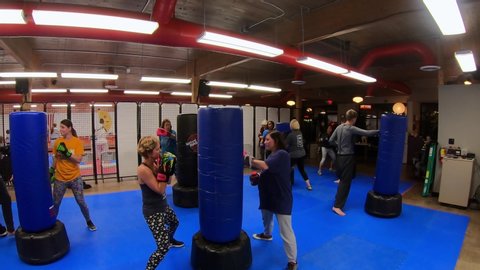Moline , Illinois / United States - 10 21 2019: Backhand Strike Exercise during Taekwando and Self Defense Class at a martial arts studio