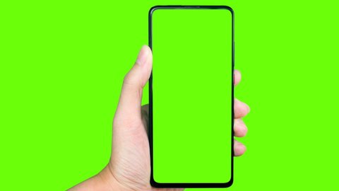 man's hand holding a mobile telephone with a vertical green screen in tram chroma key smartphone technology cell phone touch message display hand with luma white and black key