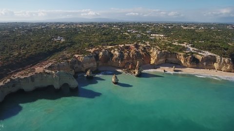 Aerial. Portuguese beach Marinha with cliffs in the form of an arch, aerial view. Algarve Albufeira.