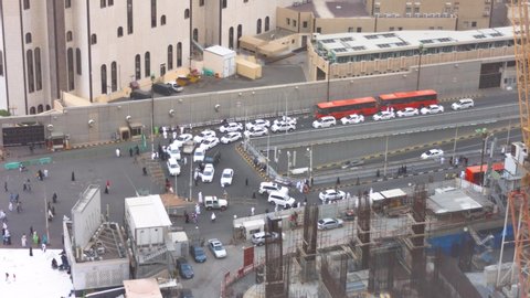 Makkah, Saudi Arabia - January 31, 2020: Aerial footage of the holy mosque dropping off point before prayer time. Pilgrims heading to the holy mosque