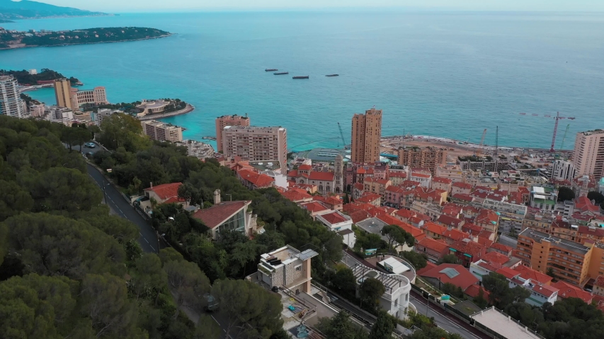 Aerial view of the city buildings in Monaco. Mediterranean sea skyline on the background