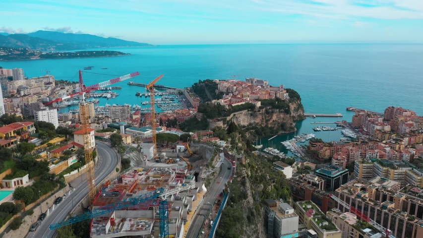 Aerial view of the city buildings in Monaco. Mediterranean sea skyline on the background