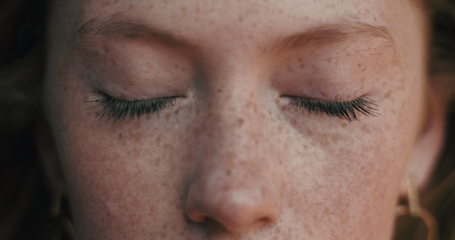Close up of Woman’s Face, Girl opening her Beautiful blue azzure Eyes, Attractive Ginger. Natural Beauty with Freckles. Gorgeous woman with long Eyelashes and Attractive Appearance. Slow motion. Royalty-Free Stock Footage #1046054536