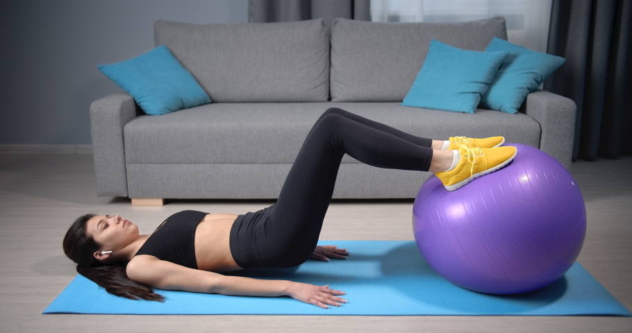 Slender Girl In Black Bodysuit Doing Stretching Exercises During Fitness Training Against Green 4304