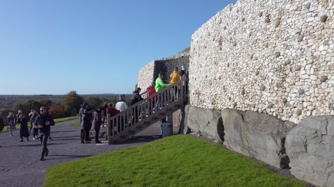 Drogheda , County Meath / Ireland - 11 09 2019: Newgrange is part of the Boyne valley tombs and is a complex of Neolithic mounds, chamber tombs, standing stones, henges and other prehistoric enclosure