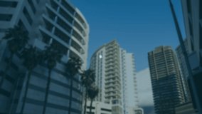 Animation of network of connections and icons moving over out of focus cityscape with modern office buildings in the background. Digital network of global connections networking business concept. - Powered by Shutterstock - Get 15% off with code: PIKWIZARD15