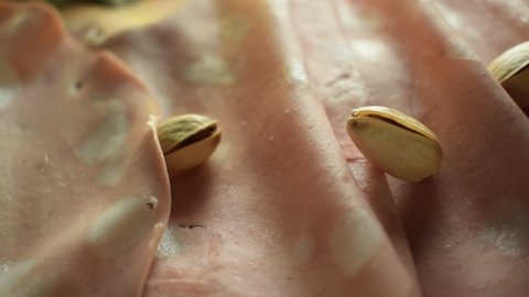 Bologna mortadella slices with pistachios