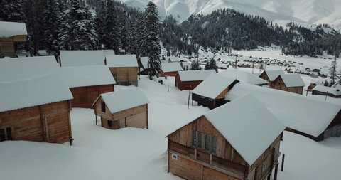 Bakhmaro in winter, Guria, Georgia. White nature of winter resort Bakhmaro in country Georgia. Amazing and beautiful snowy nature with colorful wood houses. Video , footage 4k 