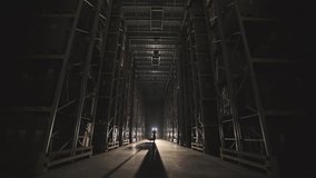 The beginning of the working day at the factory, men walk through the warehouse with a trolley - Powered by Shutterstock - Get 15% off with code: PIKWIZARD15