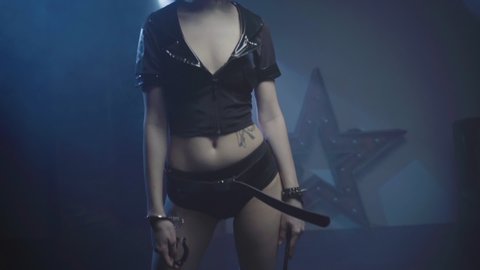 Woman In Erotic Clothing For BDSM Domination